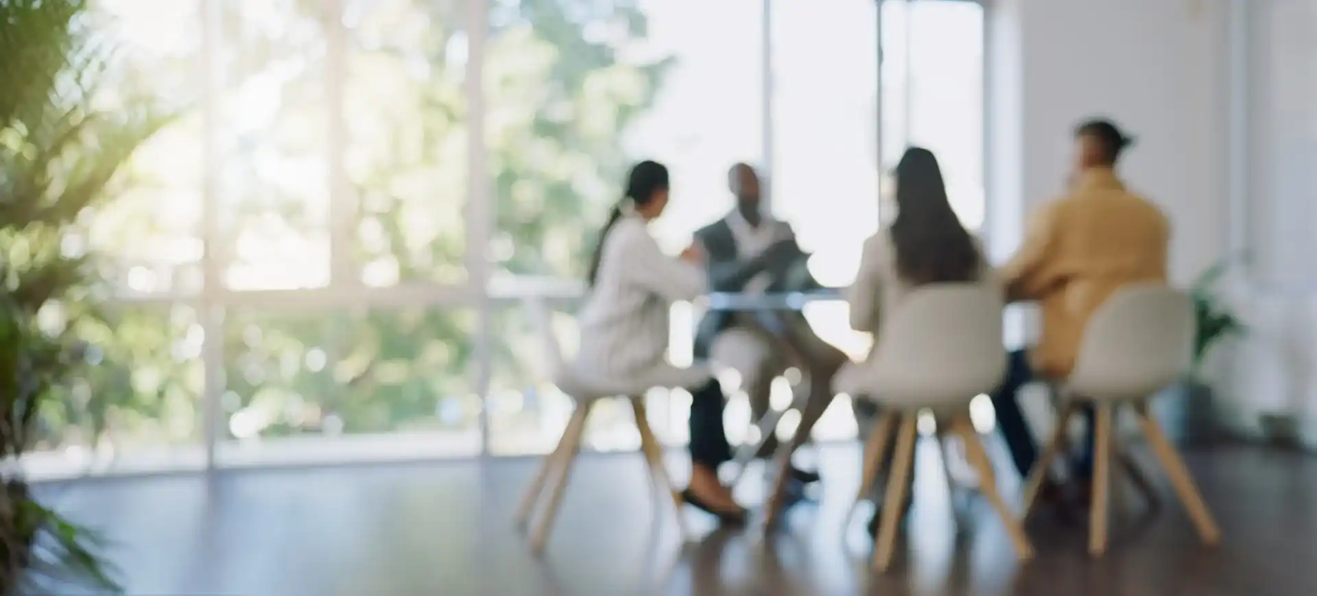 Professional renovation team outlining project budgets in a bright conference room