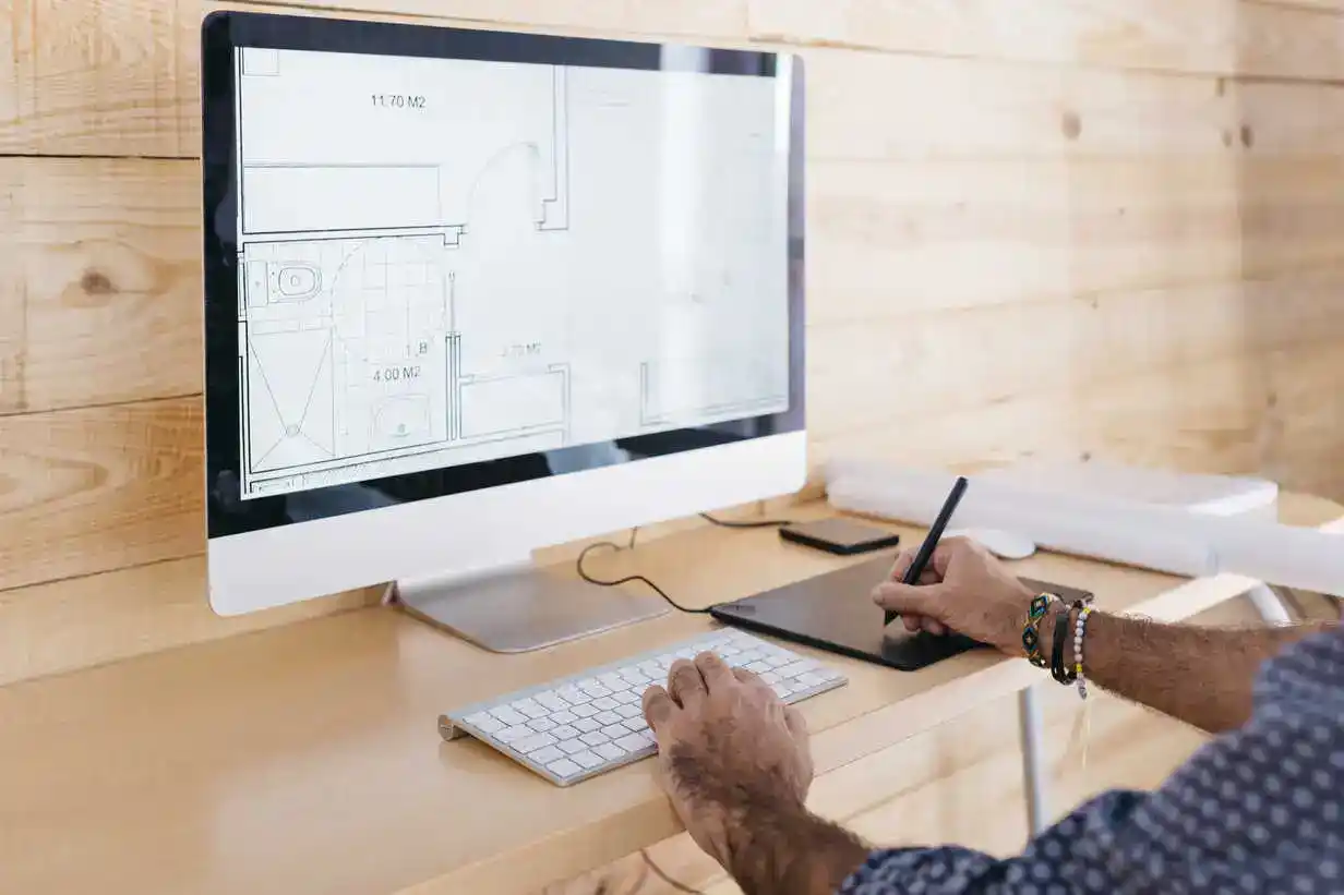 Designer working on 3D home layout services Maryland on a desktop monitor
