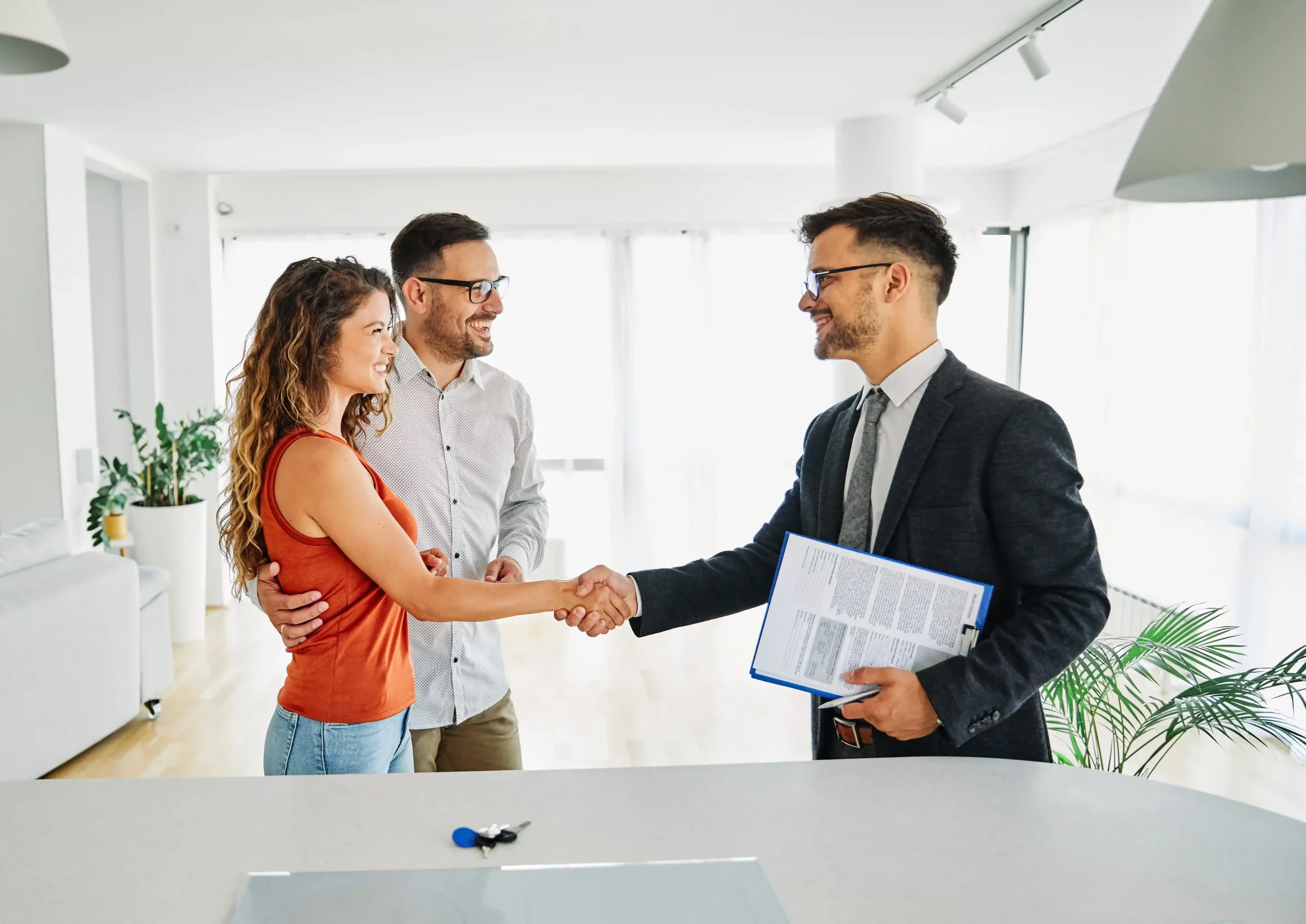 Contractor shaking hands with a homeowner client after a remodeling consultation.