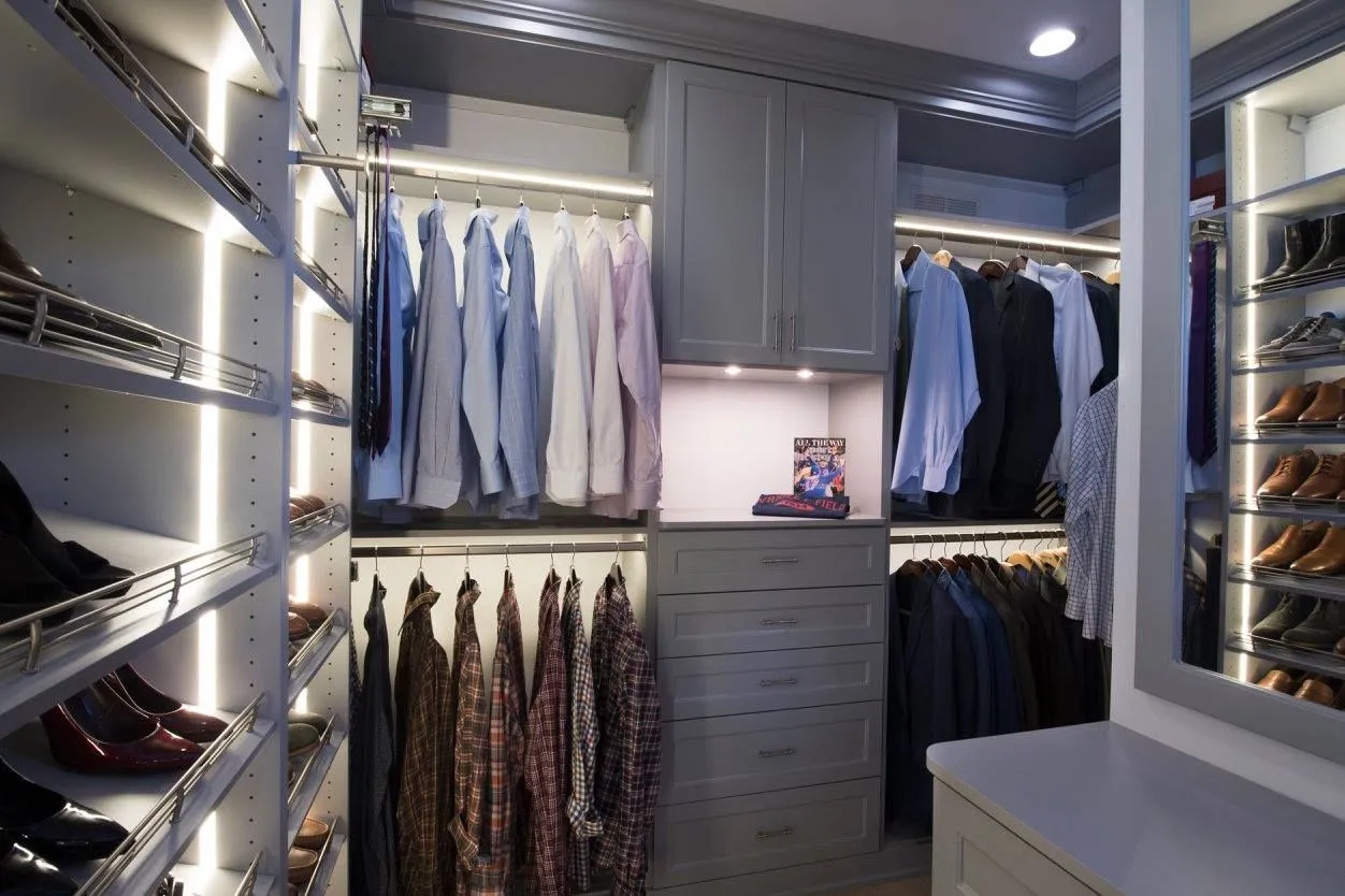 Custom closet design featuring integrated LED lighting and storage solutions