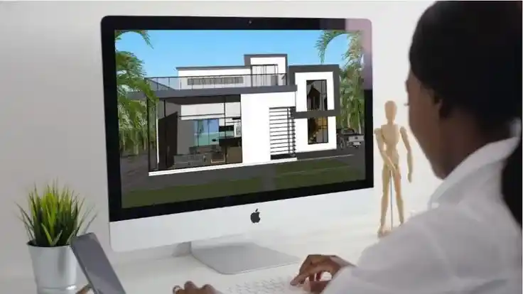 Designer working on 3D home layout services Maryland on a desktop monitor.